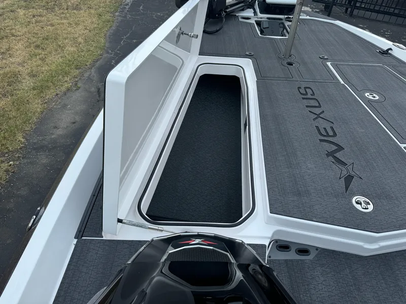 Slide: The Image of 2025 Vexus VXS21 boat with open storage compartment on deck. - 31