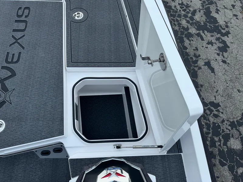 Slide: The Image of 2025 Vexus VXS21 boat deck with storage compartment and sleek design. - 32