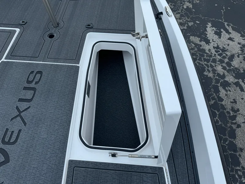 Slide: The Image of 2025 Vexus VXS21 boat storage compartment with open lid, showcasing interior space. - 33