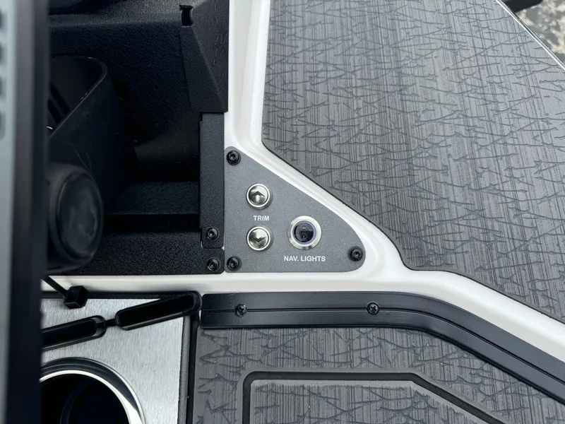 Slide: The Image of 2025 Vexus VXS21 boat dashboard with trim and navigation light controls. - 36