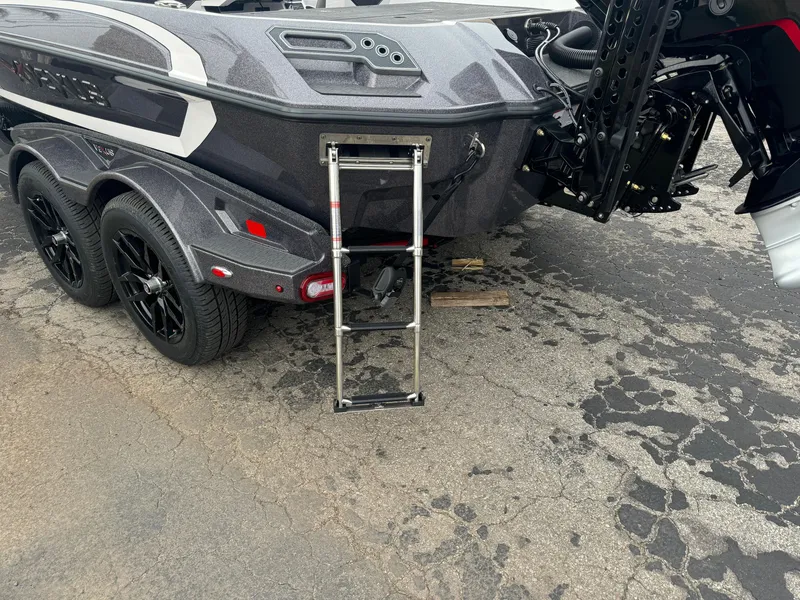 Slide: The Image of 2025 Vexus VXS21 boat trailer with ladder and dual axles on asphalt. - 4