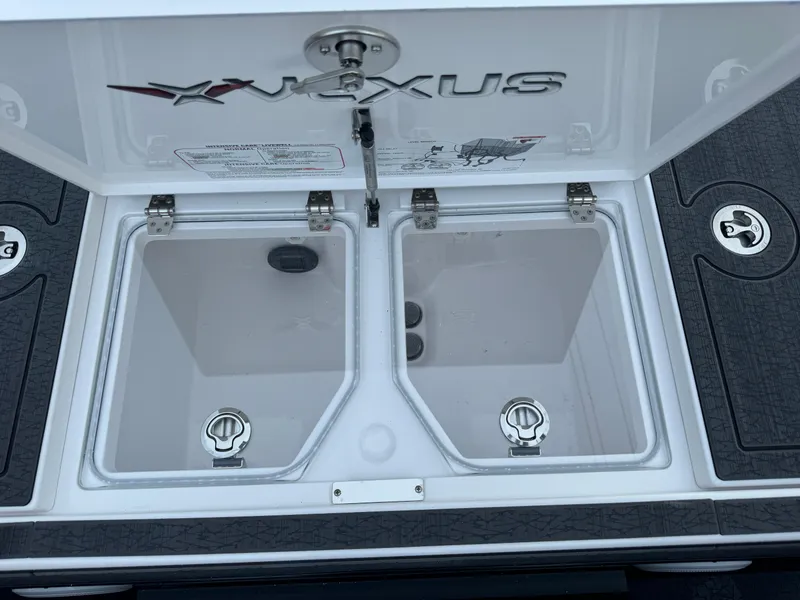 Slide: The Image of 2025 Vexus VXS21 boat storage compartments with secure latches and sleek design. - 41