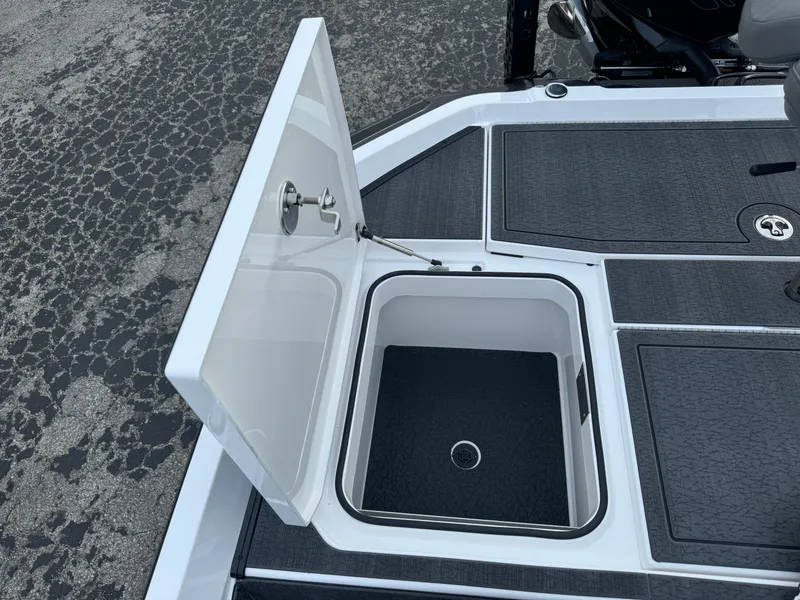 Slide: The Image of Open storage compartment on 2025 Vexus VXS21 boat deck. - 44