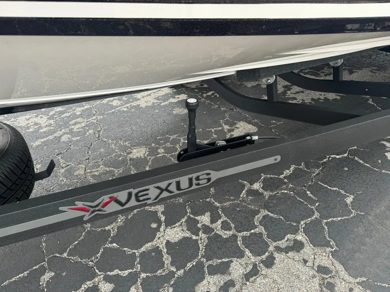 Slide: The Image of 2025 Vexus VXS21 boat trailer on cracked pavement. - 5
