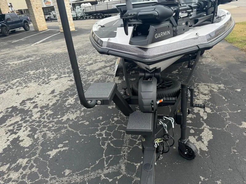 Slide: The Image of 2025 Vexus VXS21 boat with Garmin equipment on a trailer in a parking lot. - 9