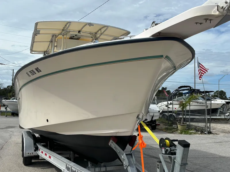 Slide: The Image of 2005 Grady-White Bimini 306 boat on trailer, parked outdoors. - 11