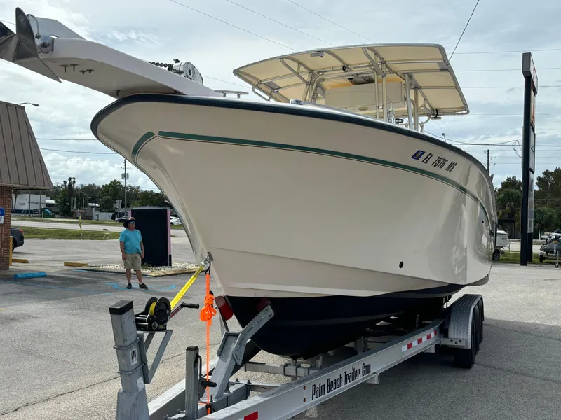 Slide: The Image of 2005 Grady-White Bimini 306 boat on trailer in parking lot. - 12