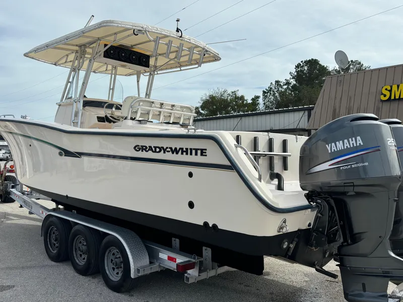 Slide: The Image of 2005 Grady-White Bimini 306 boat on trailer with Yamaha outboard motor. - 14