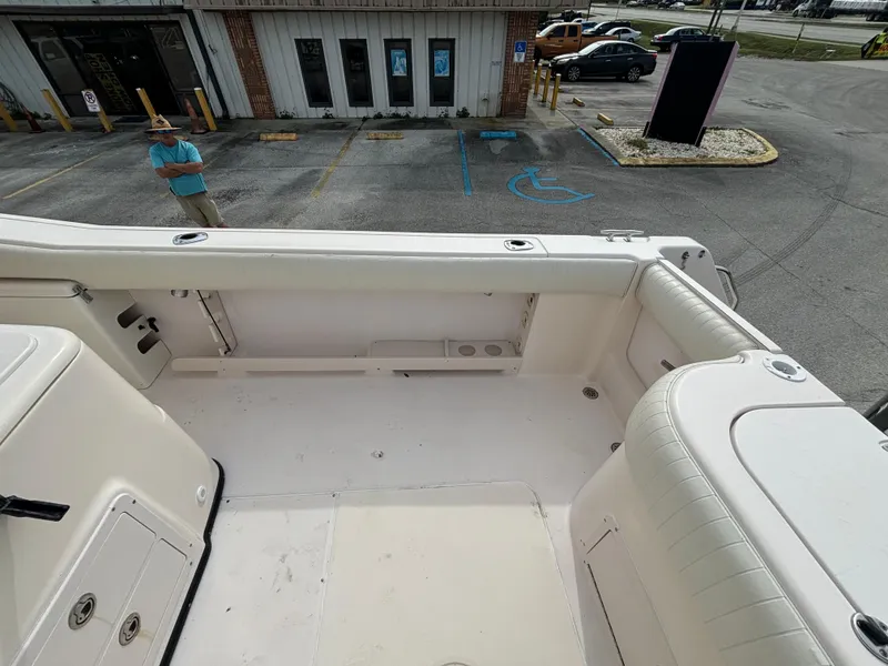 Slide: The Image of 2005 Grady-White Bimini 306 boat interior, spacious seating, and storage area. - 24