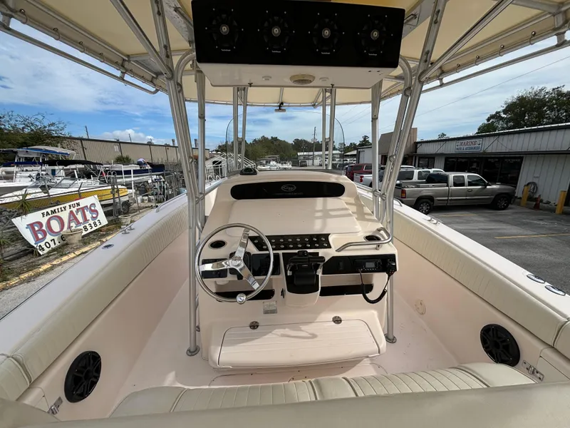 Slide: The Image of 2005 Grady-White Bimini 306 boat interior with steering console and seating. - 26
