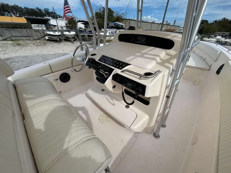 Slide: The Image of 2005 Grady-White Bimini 306 boat interior with steering console and seating. - 28