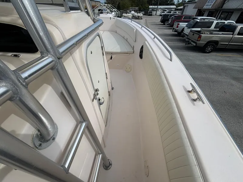 Slide: The Image of 2005 Grady-White Bimini 306 boat interior with seating and storage compartments. - 31