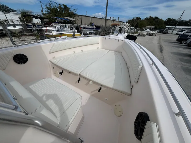 Slide: The Image of 2005 Grady-White Bimini 306 boat with spacious seating and white cushions. - 32