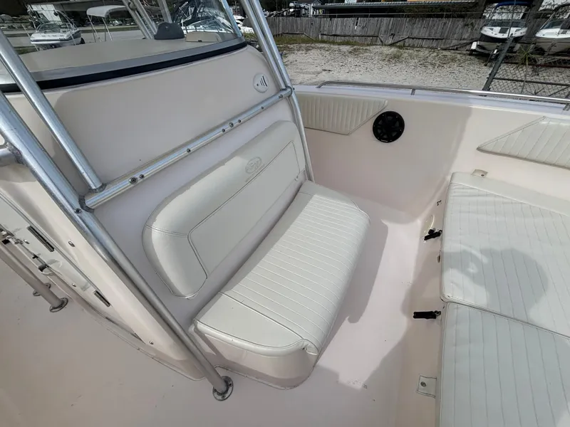 Slide: The Image of 2005 Grady-White Bimini 306 boat interior with cushioned seating and stainless steel frame. - 33