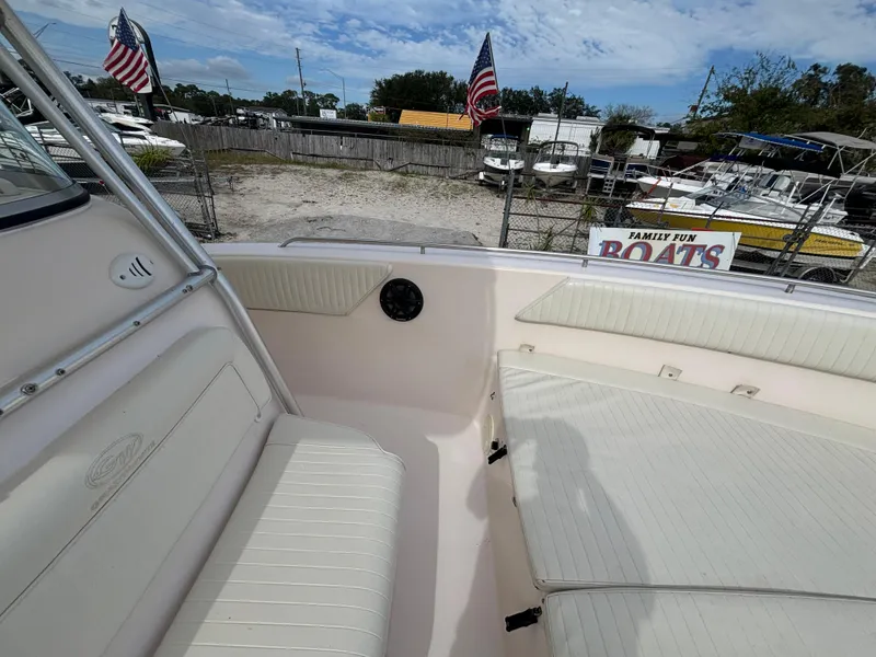 Slide: The Image of 2005 Grady-White Bimini 306 boat interior with seating and American flags. - 35