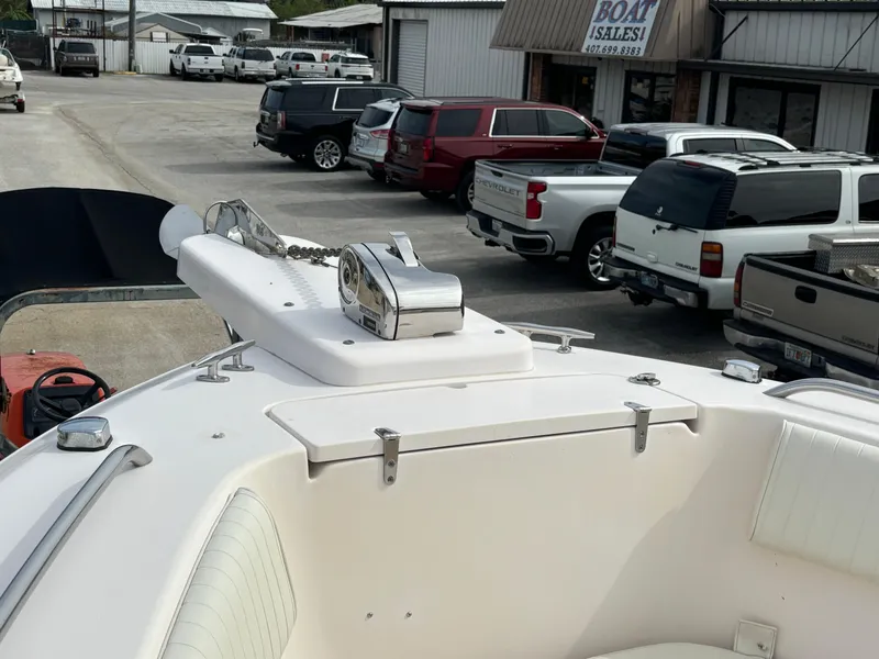 Slide: The Image of 2005 Grady-White Bimini 306 boat at dealership, surrounded by parked vehicles. - 36