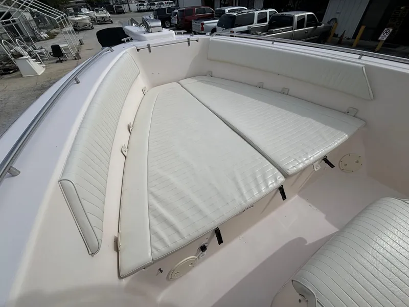 Slide: The Image of 2005 Grady-White Bimini 306 boat interior with cushioned seating area. - 37