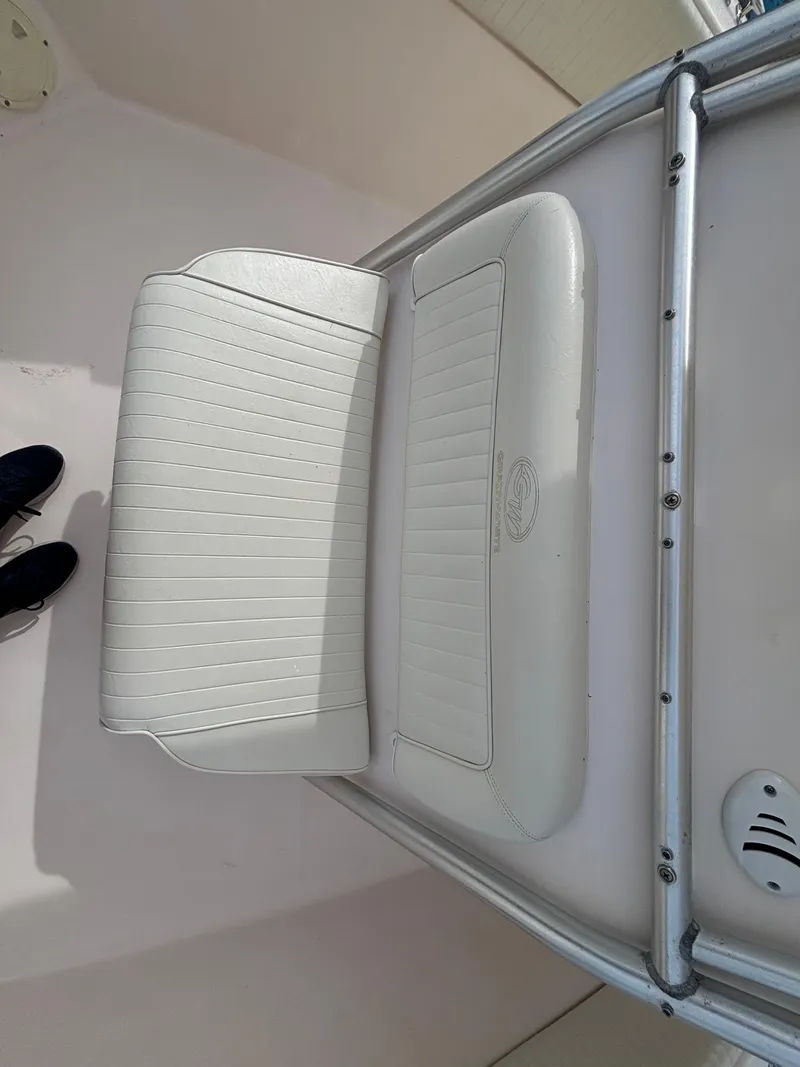 Slide: The Image of 2005 Grady-White Bimini 306 boat seat, white upholstery, sleek design. - 39