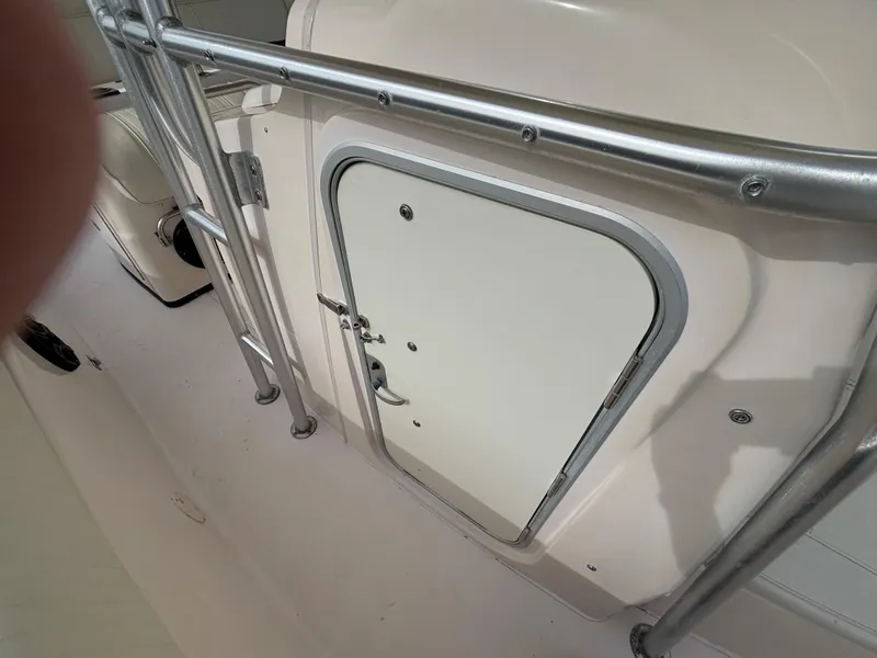 Slide: The Image of 2005 Grady-White Bimini 306 boat hatch with metal railing. - 40