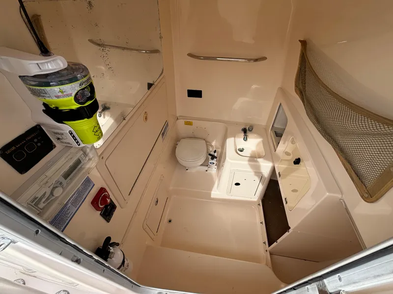 Slide: The Image of 2005 Grady-White Bimini 306 boat interior with toilet and sink. - 41