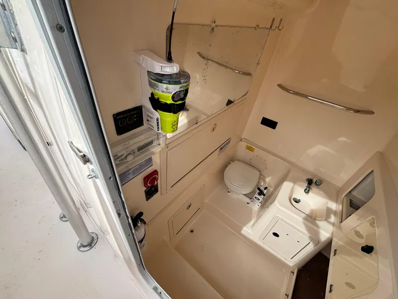 Slide: The Image of 2005 Grady-White Bimini 306 boat interior with compact bathroom amenities. - 42