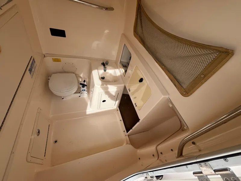 Slide: The Image of 2005 Grady-White Bimini 306 boat interior with toilet and sink. - 43
