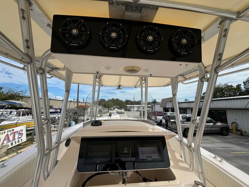 Slide: The Image of 2005 Grady-White Bimini 306 boat interior with speakers and navigation system. - 45