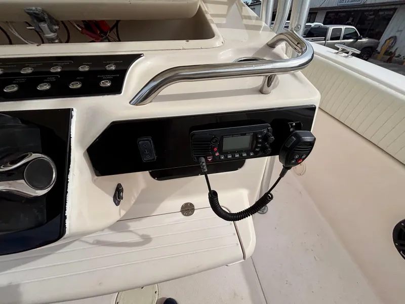 Slide: The Image of 2005 Grady-White Bimini 306 boat console with radio and controls. - 49