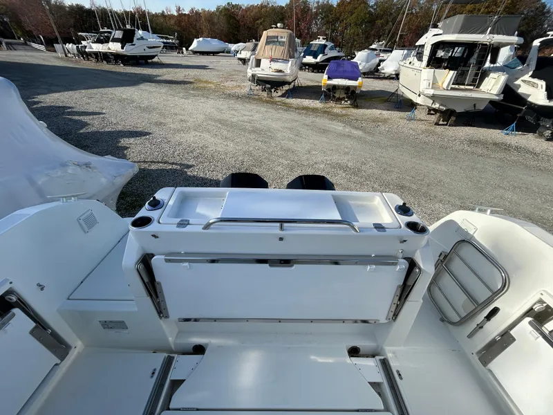 Slide: The Image of 2020 Beneteau Barracuda boat interior, docked in a marina with other vessels. - 11