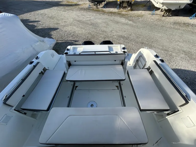 Slide: The Image of 2020 Beneteau Barracuda boat interior with white seating and spacious layout. - 12