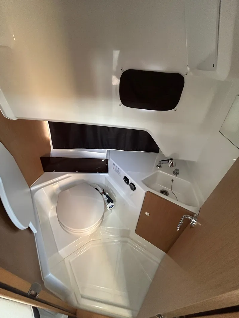 Slide: The Image of 2020 Beneteau Barracuda boat interior bathroom with sink and toilet. - 17