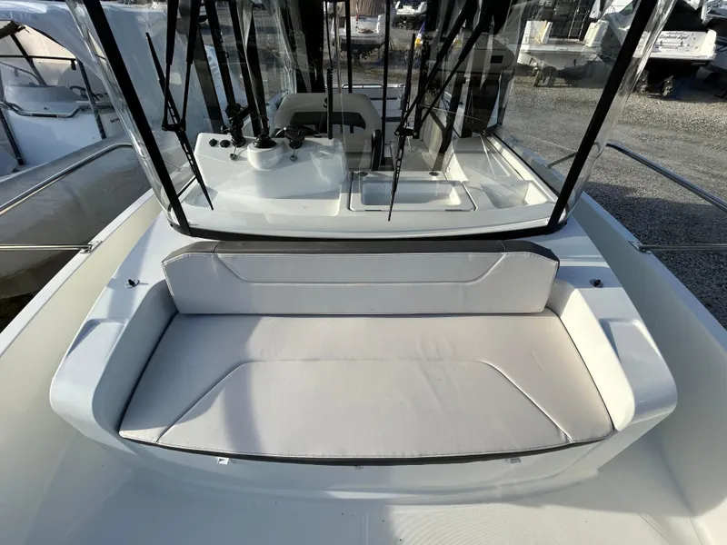 Slide: The Image of 2020 Beneteau Barracuda boat interior with cushioned seating and windshield. - 3