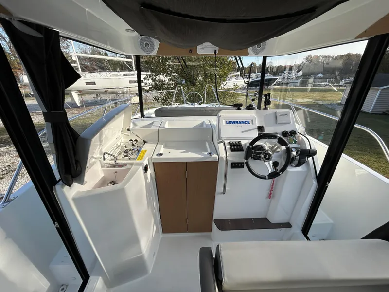 Slide: The Image of Interior of 2020 Beneteau Barracuda boat with steering wheel and navigation equipment. - 5