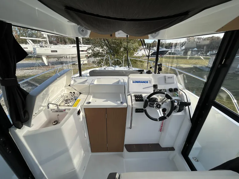 Slide: The Image of Interior of 2020 Beneteau Barracuda boat with steering wheel and navigation equipment. - 6