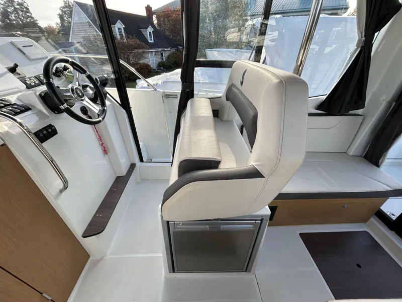 Slide: The Image of Interior of 2020 Beneteau Barracuda boat with steering wheel and seating. - 8