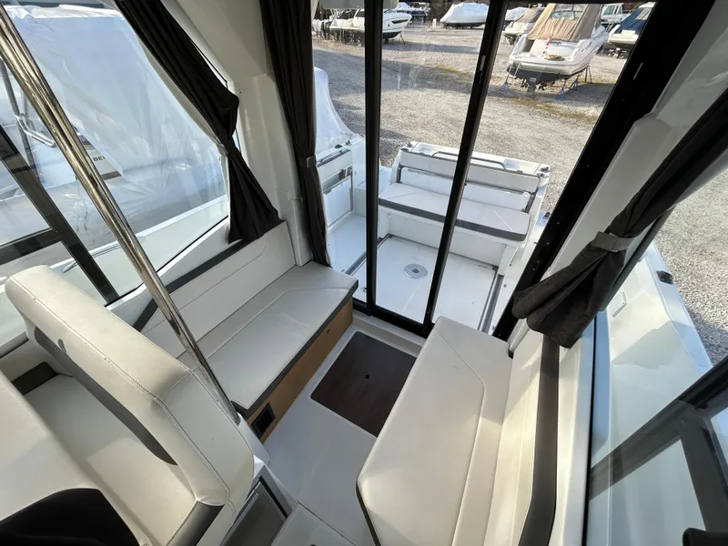 Slide: The Image of Interior view of 2020 Beneteau Barracuda boat with seating and glass doors. - 9