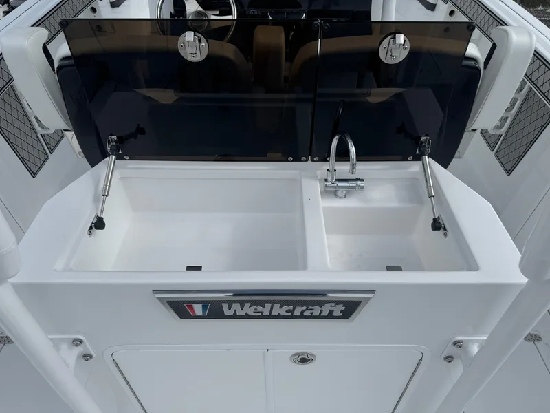 Slide: The Image of 2025 Wellcraft 302 Fisherman boat sink and faucet setup. - 10