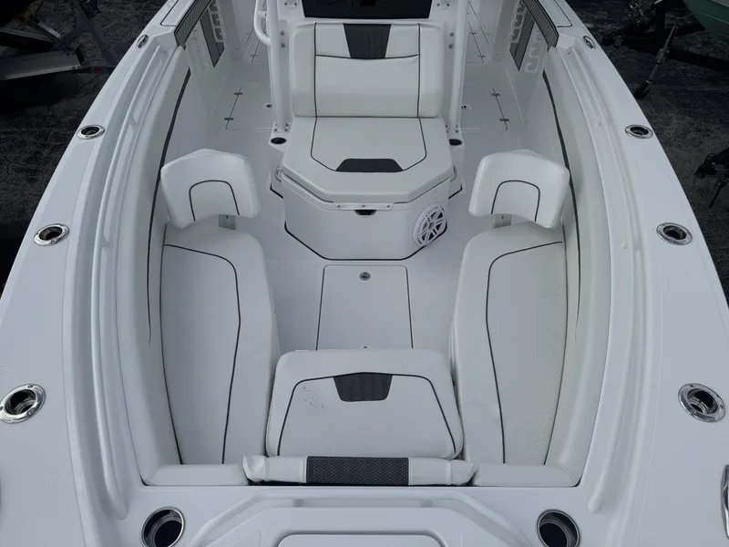 Slide: The Image of 2025 Wellcraft 302 Fisherman boat interior with white seating and modern design. - 23
