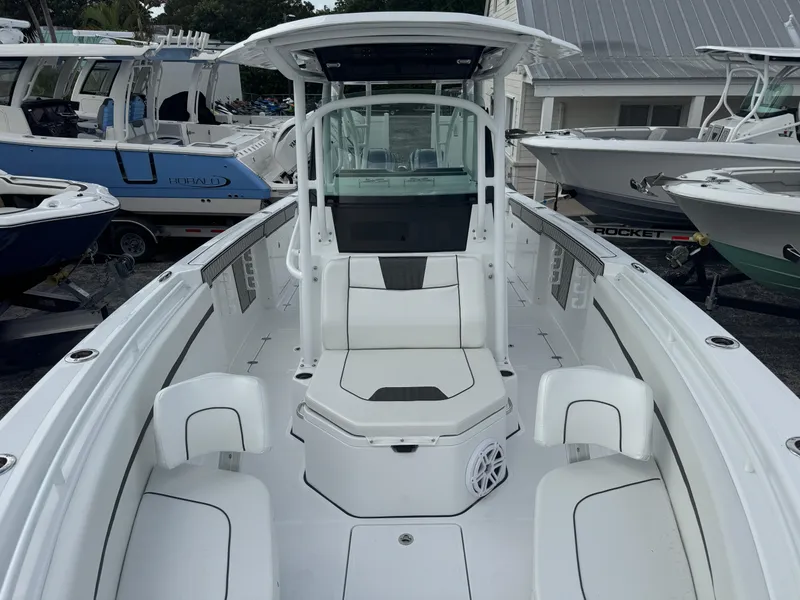 Slide: The Image of 2025 Wellcraft 302 Fisherman boat, sleek white design, spacious deck, modern console. - 24