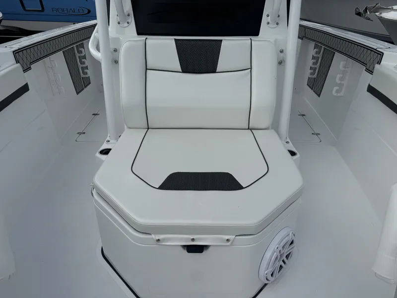 Slide: The Image of 2025 Wellcraft 302 Fisherman boat interior with cushioned seating. - 25
