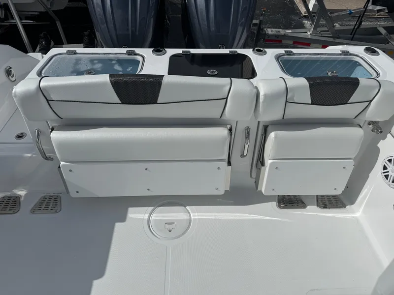 Slide: The Image of 2025 Wellcraft 302 Fisherman boat interior with seating and storage compartments. - 5