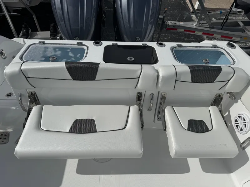 Slide: The Image of 2025 Wellcraft 302 Fisherman boat seating and storage compartments. - 6