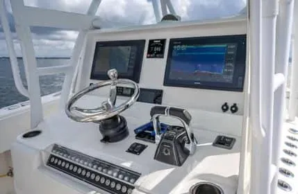 Slide: The Image of 2019 Invincible 36 Open Fisherman helm with dual screens and controls. - 11