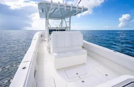 Slide: The Image of 2019 Invincible 36 Open Fisherman boat on open sea under blue sky. - 12