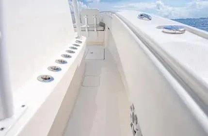 Slide: The Image of 2019 Invincible 36 Open Fisherman boat deck with rod holders, ocean view. - 14