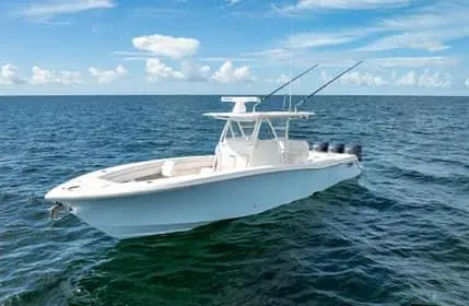 Slide: The Image of 2019 Invincible 36 Open Fisherman boat on open ocean under blue sky. - 16