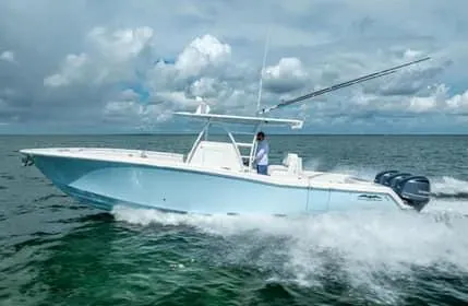 Slide: The Image of 2019 Invincible 36 Open Fisherman boat cruising on open water. - 2