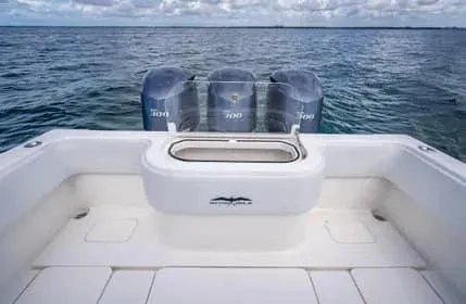 Slide: The Image of 2019 Invincible 36 Open Fisherman boat with triple engines on open water. - 23