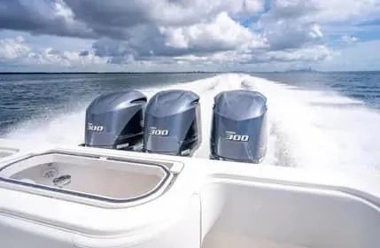 Slide: The Image of 2019 Invincible 36 Open Fisherman with triple 300 horsepower engines cruising on open water. - 24