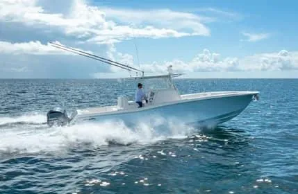 Slide: The Image of 2019 Invincible 36 Open Fisherman boat cruising on open sea under clear skies. - 28